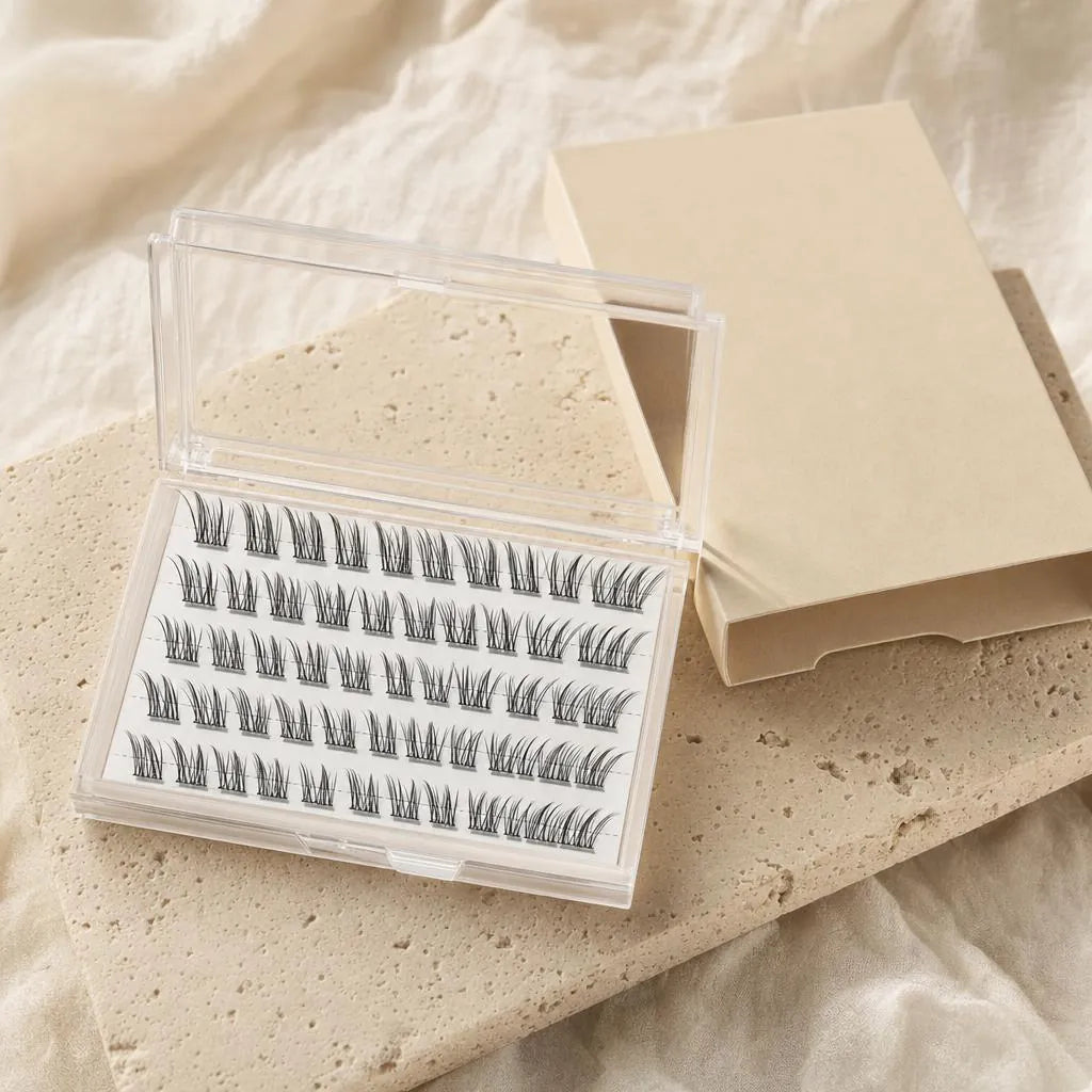 Buviro press-on lash clusters in a clear case next to a plain sand-colored box