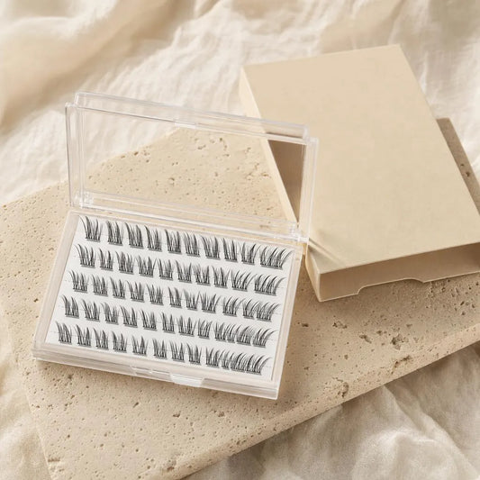 Buviro press-on lash clusters in a clear case next to a plain sand-colored box